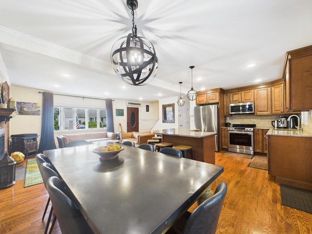 260 9th St, Bethpage, NY 11714 - dining area with wood finished floors, a chandelier, recessed lighting, and ornamental molding