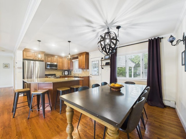 260 9th St, Bethpage, NY 11714 - dining area with baseboard heating, ornamental molding, dark wood-type flooring, a chandelier, and recessed lighting