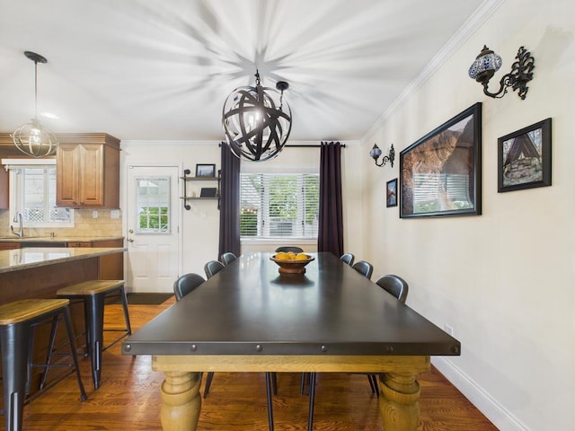 260 9th St, Bethpage, NY 11714 - dining room with ornamental molding, healthy amount of natural light, wood finished floors, and a chandelier
