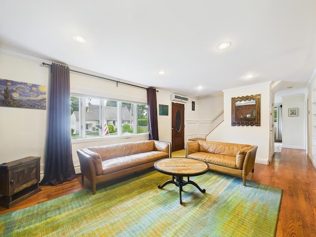260 9th St, Bethpage, NY 11714 - living room with wood finished floors, a wall unit AC, recessed lighting, and ornamental molding
