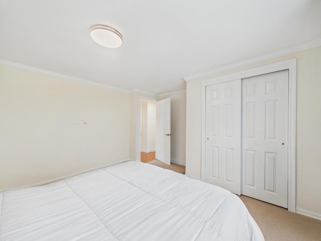260 9th St, Bethpage, NY 11714 - bedroom with ornamental molding, a closet, and light colored carpet