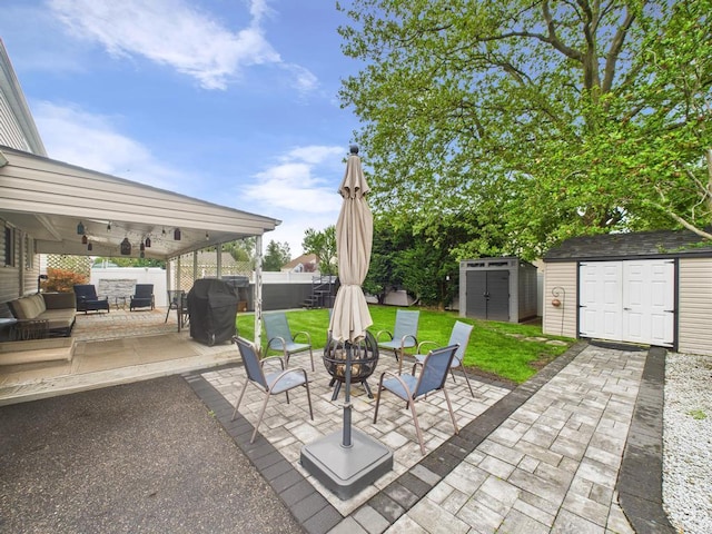 260 9th St, Bethpage, NY 11714 - view of patio / terrace with a storage shed, a fire pit, and area for grilling