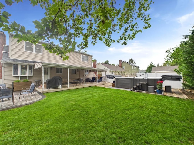 260 9th St, Bethpage, NY 11714 - view of grassy yard with a hot tub and a patio area