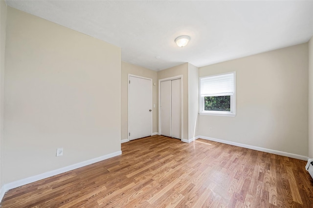 10 Leach St, Lynbrook, NY 11563 - empty room featuring light wood finished floors and baseboards