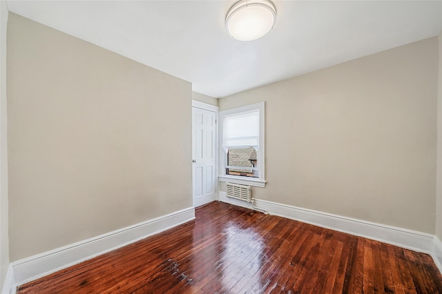10 Leach St, Lynbrook, NY 11563 - unfurnished room with baseboards and dark wood-type flooring