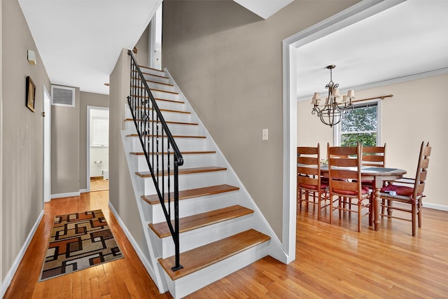 34 Winter Hill Rd, Tuckahoe, NY 10707 - staircase featuring wood-type flooring and a chandelier