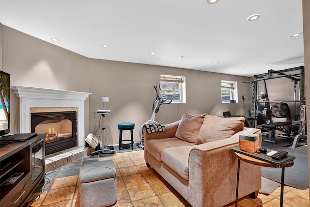 34 Winter Hill Rd, Tuckahoe, NY 10707 - living room with recessed lighting, a tiled fireplace, and stone tile floors