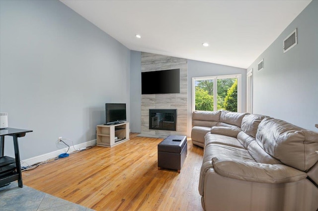 8 Kilmer Ave, Dix Hills, NY 11746 - living area featuring vaulted ceiling, light wood finished floors, a premium fireplace, and recessed lighting
