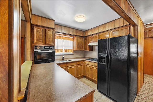 1112 Saint Lawrence Ave Front, Front, Bronx, NY 10472 - kitchen featuring black appliances, decorative backsplash, light tile patterned floors, light countertops, and brown cabinetry