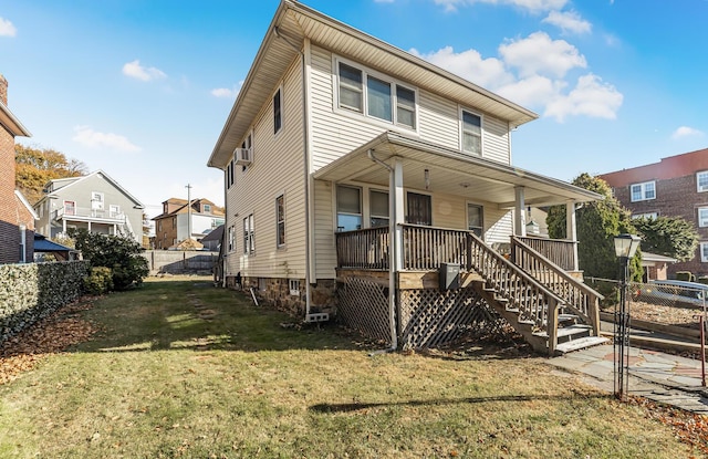 22 King Ave, Yonkers, NY 10704 - back of house with a fenced backyard, stairway, covered porch, and a residential view