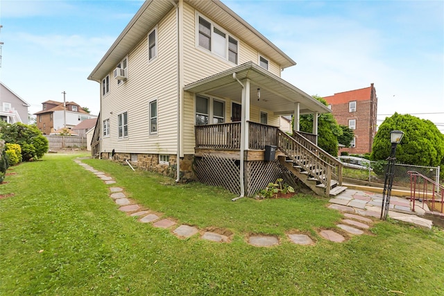 22 King Ave, Yonkers, NY 10704 - rear view of property featuring covered porch, stairs, and a gate