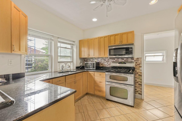 22 King Ave, Yonkers, NY 10704 - kitchen with stainless steel appliances, healthy amount of natural light, decorative backsplash, ceiling fan, and recessed lighting