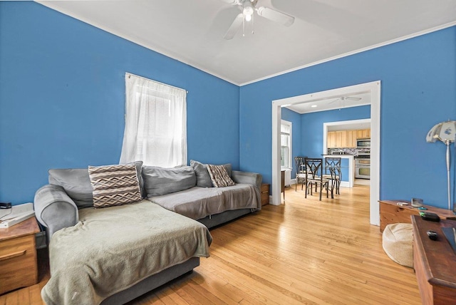 22 King Ave, Yonkers, NY 10704 - living area featuring a ceiling fan, ornamental molding, and light wood-type flooring