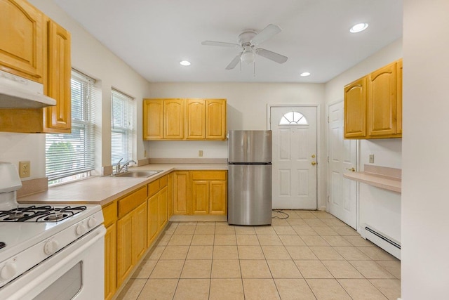 22 King Ave, Yonkers, NY 10704 - kitchen with freestanding refrigerator, white gas range, baseboard heating, ceiling fan, and light countertops