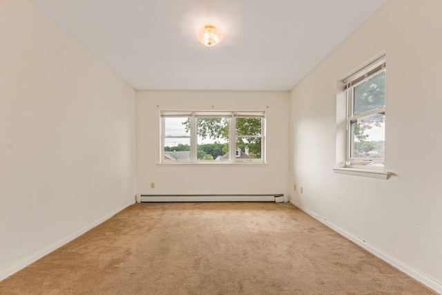 22 King Ave, Yonkers, NY 10704 - carpeted spare room featuring a baseboard heating unit and plenty of natural light