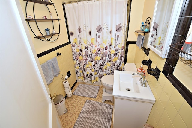 22 Hollywood Ave, Lynbrook, NY 11563 - bathroom with tile walls, vanity, a shower with curtain, a wainscoted wall, and tile patterned flooring