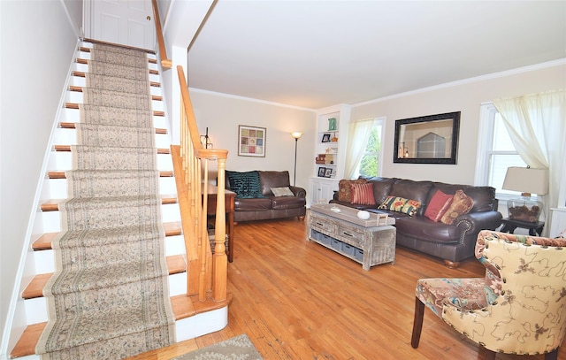 22 Hollywood Ave, Lynbrook, NY 11563 - living area with stairway, light wood-style floors, and crown molding