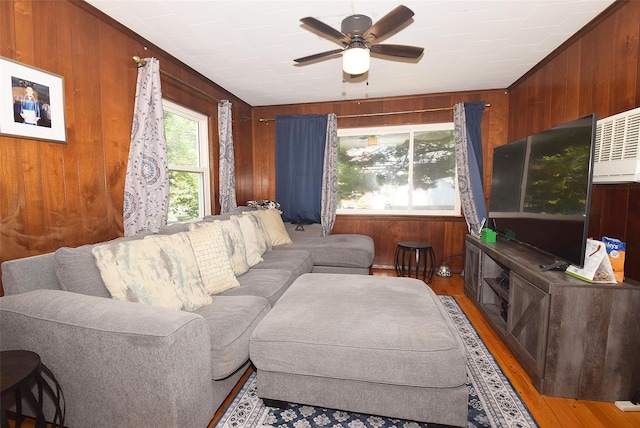 22 Hollywood Ave, Lynbrook, NY 11563 - living area featuring wood walls, ceiling fan, and light wood-style flooring