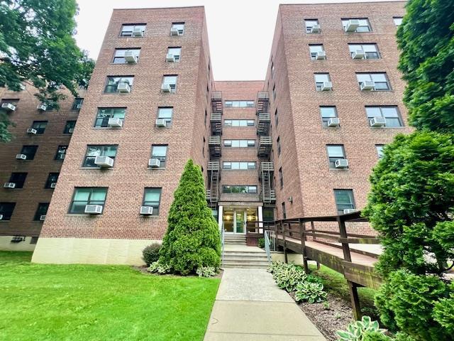 75-15 210th St Unit 2E, Bayside, NY 11364 - view of apartment building / complex with cooling unit