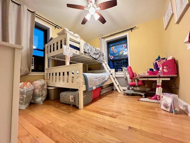 75-15 210th St Unit 2E, Bayside, NY 11364 - bedroom with hardwood / wood-style floors and ceiling fan