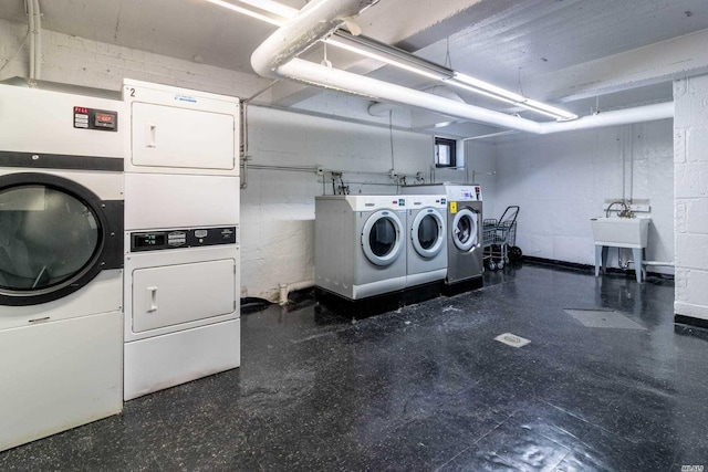 75-15 210th St Unit 2E, Bayside, NY 11364 - shared laundry featuring stacked washer / drying machine, washing machine and clothes dryer, and tile patterned floors