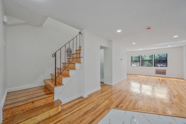 11708A 233rd St, Cambria Heights, NY 11411 - stairs featuring wood finished floors and recessed lighting