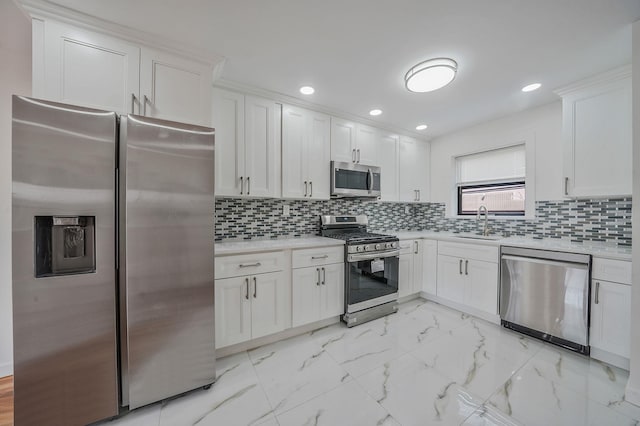 11708A 233rd St, Cambria Heights, NY 11411 - kitchen with appliances with stainless steel finishes, light countertops, white cabinets, and recessed lighting