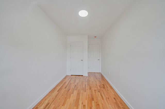 11708A 233rd St, Cambria Heights, NY 11411 - hall with light wood-style flooring and baseboards