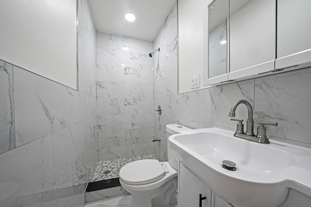 11708A 233rd St, Cambria Heights, NY 11411 - bathroom featuring tiled shower, vanity, and tile walls