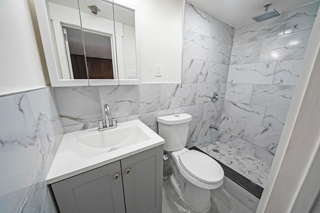 11708A 233rd St, Cambria Heights, NY 11411 - full bathroom with vanity, tiled shower, tile walls, and marble look tile flooring
