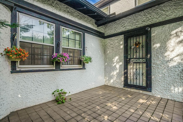 18803 Ilion Ave, Saint Albans, NY 11412 - doorway to property featuring stucco siding