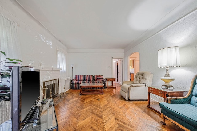 18803 Ilion Ave, Saint Albans, NY 11412 - living area with arched walkways and a brick fireplace