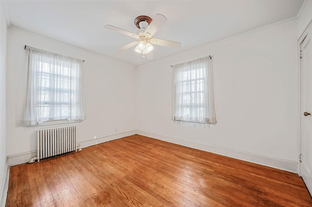18803 Ilion Ave, Saint Albans, NY 11412 - unfurnished room with radiator heating unit, wood-type flooring, ceiling fan, and ornamental molding