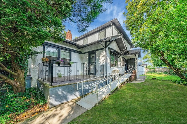 18803 Ilion Ave, Saint Albans, NY 11412 - view of front facade with stucco siding and a chimney