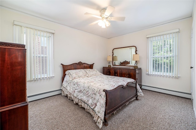 10 Wilton St, New Hyde Park, NY 11040 - carpeted bedroom featuring a baseboard radiator and a ceiling fan