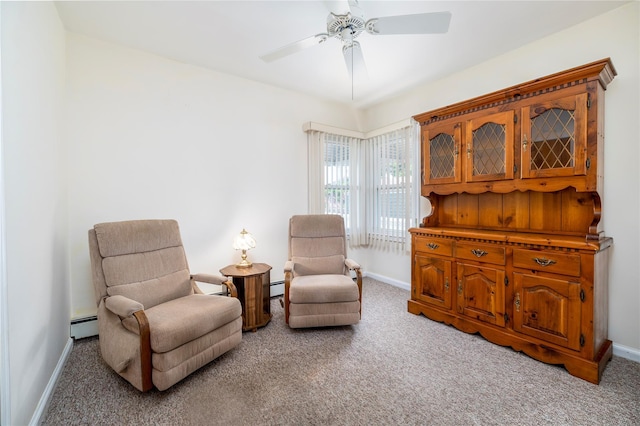 10 Wilton St, New Hyde Park, NY 11040 - living area with light carpet, ceiling fan, and baseboard heating