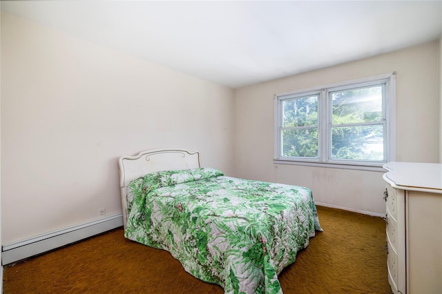 10 Wilton St, New Hyde Park, NY 11040 - bedroom featuring a baseboard heating unit and carpet flooring