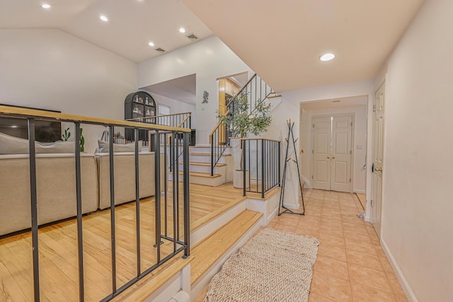 1096 Pearl St, North Woodmere, NY 11581 - staircase featuring recessed lighting, tile patterned flooring, and lofted ceiling