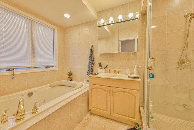 1096 Pearl St, North Woodmere, NY 11581 - bathroom featuring vanity, tile patterned flooring, a stall shower, a tub with jets, and tile walls