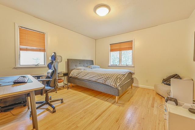 1096 Pearl St, North Woodmere, NY 11581 - bedroom with light wood-style floors and an office area