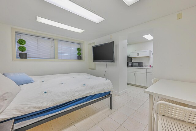 1096 Pearl St, North Woodmere, NY 11581 - bedroom with light tile patterned floors and baseboards