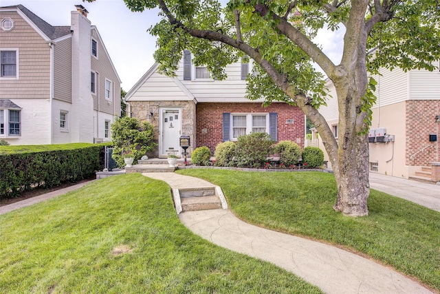 163 15th Dr, Whitestone, NY 11357 - view of front of house featuring a front yard and brick siding