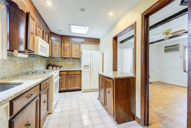 163 15th Dr, Whitestone, NY 11357 - kitchen featuring white appliances, decorative backsplash, a wall mounted AC, brown cabinetry, and light stone counters