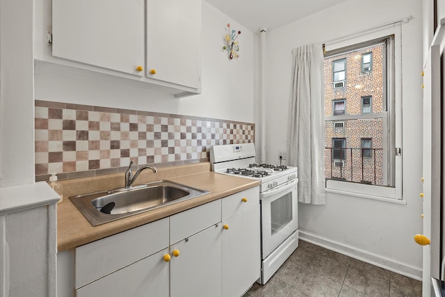 601 Pelham Pkwy N Unit 516, Bronx, NY 10467 - kitchen featuring white range with gas stovetop, white cabinetry, light countertops, and tile patterned flooring