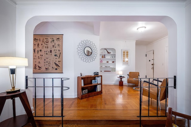 601 Pelham Pkwy N Unit 516, Bronx, NY 10467 - corridor featuring arched walkways, crown molding, and built in shelves