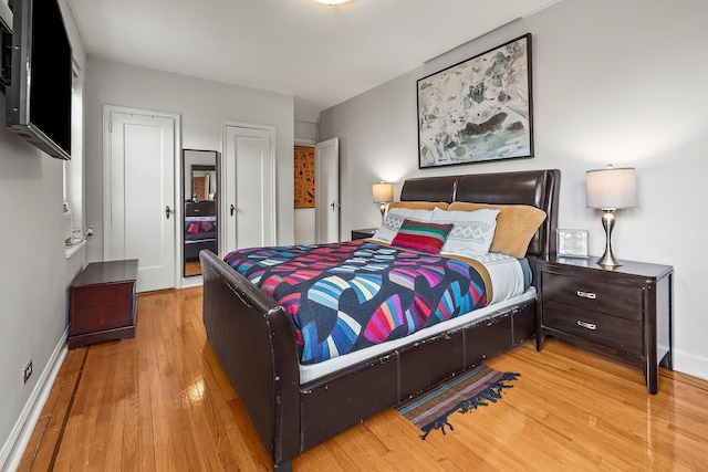 601 Pelham Pkwy N Unit 516, Bronx, NY 10467 - bedroom featuring wood finished floors and multiple closets