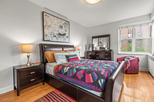 601 Pelham Pkwy N Unit 516, Bronx, NY 10467 - bedroom featuring wood finished floors and baseboards