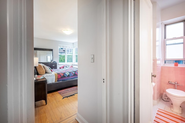 601 Pelham Pkwy N Unit 516, Bronx, NY 10467 - bedroom featuring light wood finished floors and ensuite bathroom