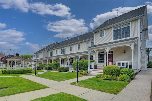19 Olivia St Unit 5, Port Chester, NY 10573 - view of front of property featuring a gazebo, covered porch, a front lawn, and a residential view