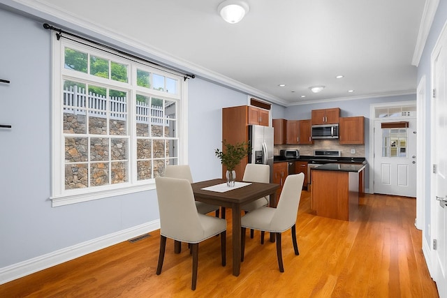 19 Olivia St Unit 5, Port Chester, NY 10573 - dining room featuring light wood finished floors, ornamental molding, and recessed lighting